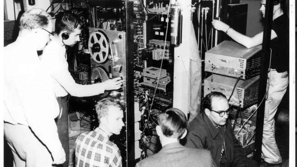 In October 1957, researchers from the Geophysical Institute track the Sputnik 1 satellite from the Ballaine Lake Tracking Station on the UAF campus. From left are Bob Merritt, Joe Pope, Pete Michelow, Gordon Little, Glen Stanley and Ernest Stiltner. Photo courtesy Geophysical Institute.