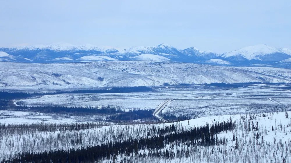 The Dalton Highway winds through the Jim River and Prospect Creek valleys in northern Alaska, where an official thermometer registered Alaska’s all-time low of minus 80 degrees F on Jan. 23, 1971. Photo by Ned Rozell.