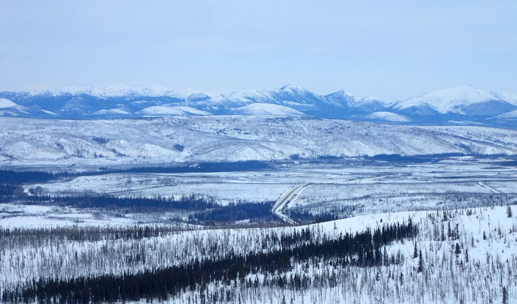 The Dalton Highway winds through the Jim River and Prospect Creek valleys in northern Alaska, where an official thermometer registered Alaska’s all-time low of minus 80 degrees F on Jan. 23, 1971. Photo by Ned Rozell.