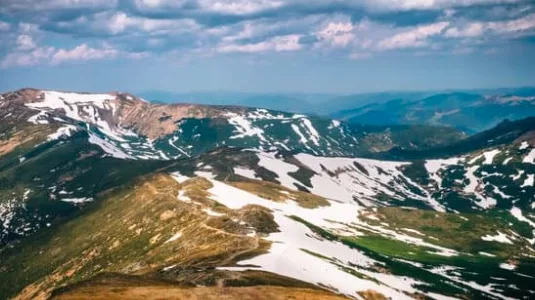 Snow melting on mountains