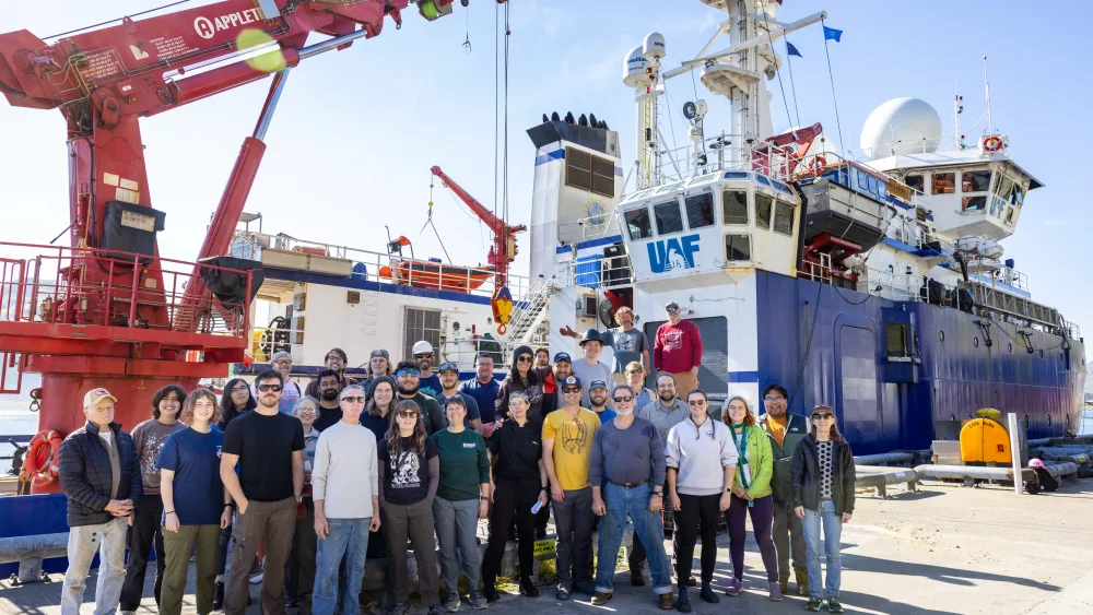 Researchers and crew members pose beside the University of Alaska Fairbanks research ship Sikuliaq in Dutch Harbor during a 2023 cruise to the Bering Sea to learn more about the Bering Land Bridge. Photo by JR Ancheta.