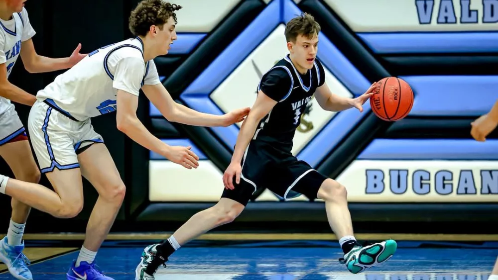 Jarrett Gage dribbles the ball against Hutchison, VHS Basketball February 2025