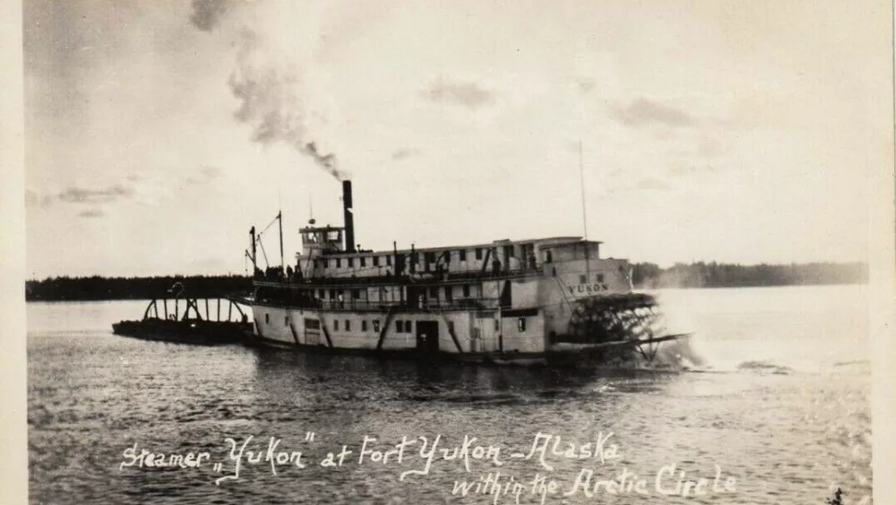The steamboat Yukon, owned by the Alaska Commercial Co., travels the Yukon River. In 1869, the boat became the first steamer to ascend the river to Fort Yukon. Public domain photo.