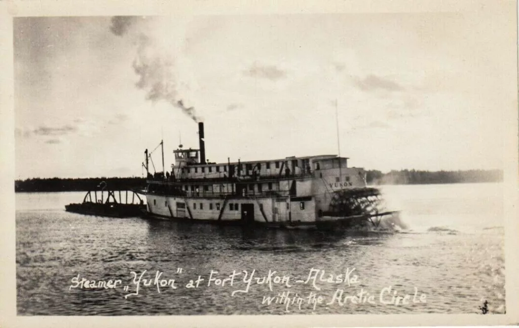 The steamboat Yukon, owned by the Alaska Commercial Co., travels the Yukon River. In 1869, the boat became the first steamer to ascend the river to Fort Yukon. Public domain photo.