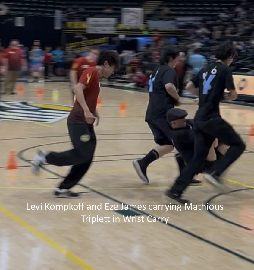 Levi Kompkoff and Eze James carrying Mathious Triplett in Wrist Carry, NYO 2025