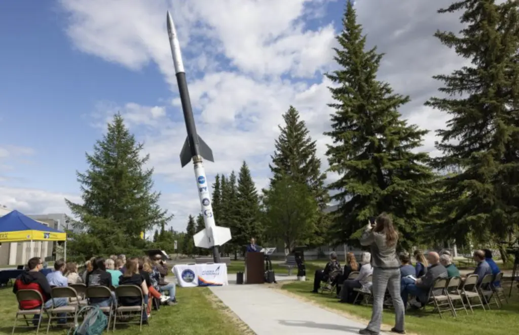A crowd watches the signing of a memorandum of understanding
between the UAF Geophysical Institute and the Alaska Aerospace Corp.
UAFGI Photo by Bryan Whitten
