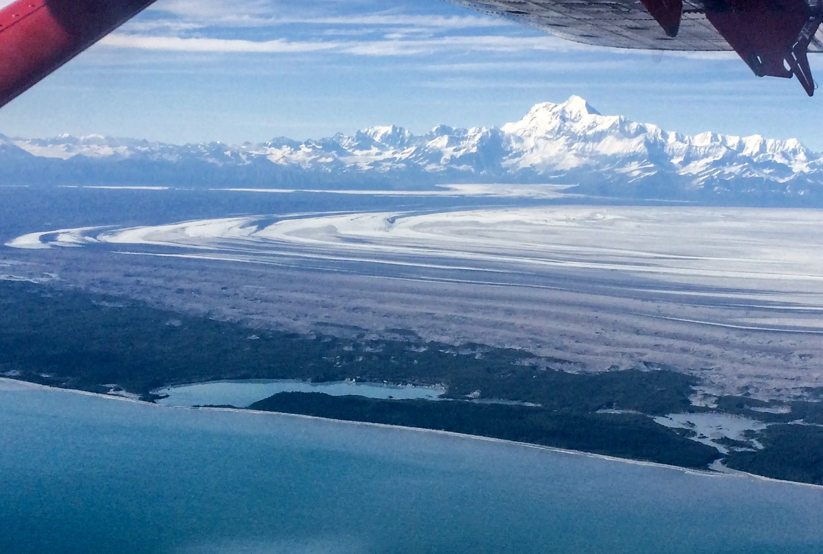 The 18,008-foot Mount St. Elias rises above Malaspina Glacier and Sitkagi Lagoon (water body center left) in 2021. Photo by Martin Truffer.