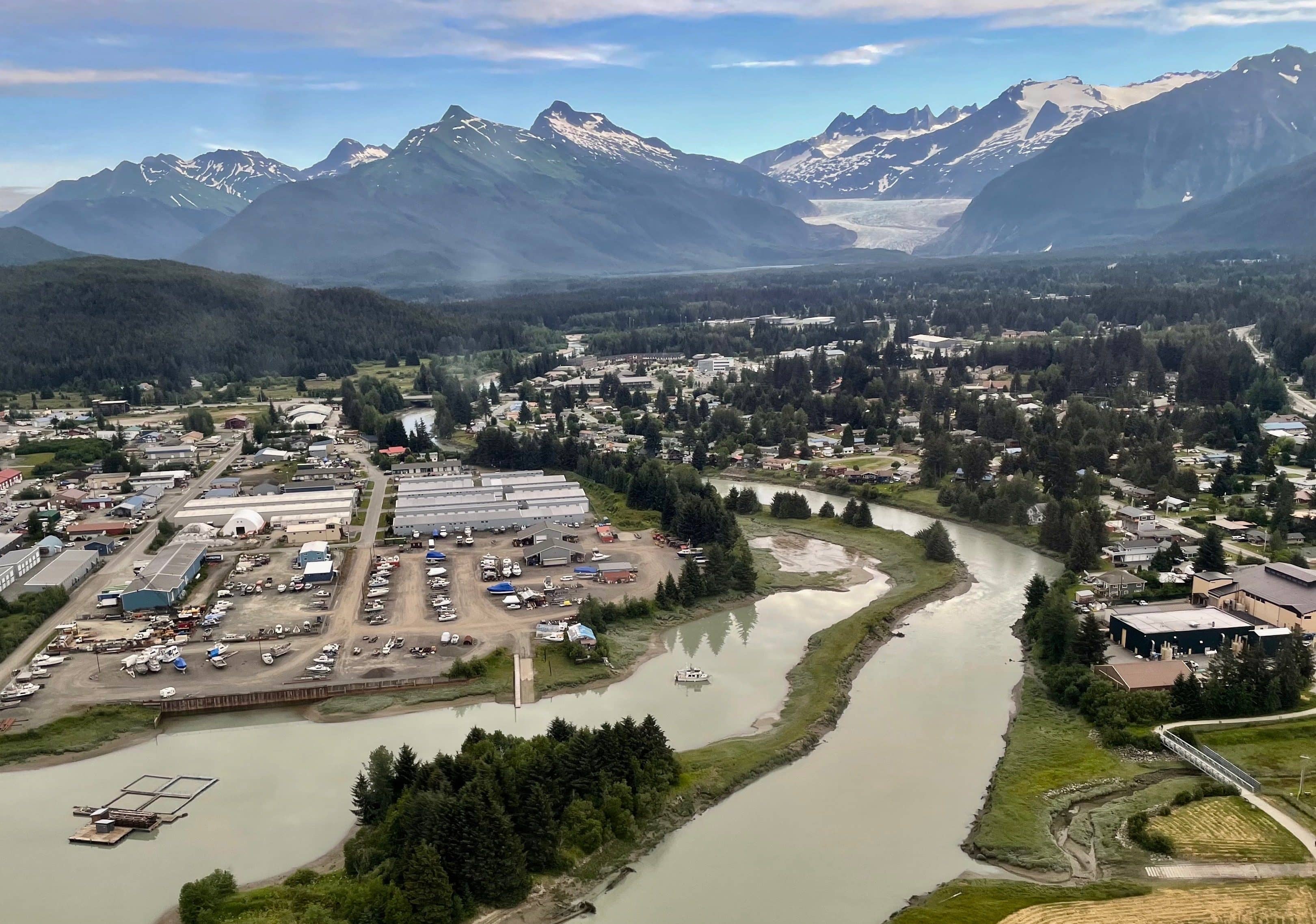 2. Juneau residences and businesses occupy the Mendenhall Glacier valley downstream from the freshwater lake create by the glacier. As the glacier retreats up the valley, its connection to the lake has grown more tenuous. Photo by Ned Rozell.