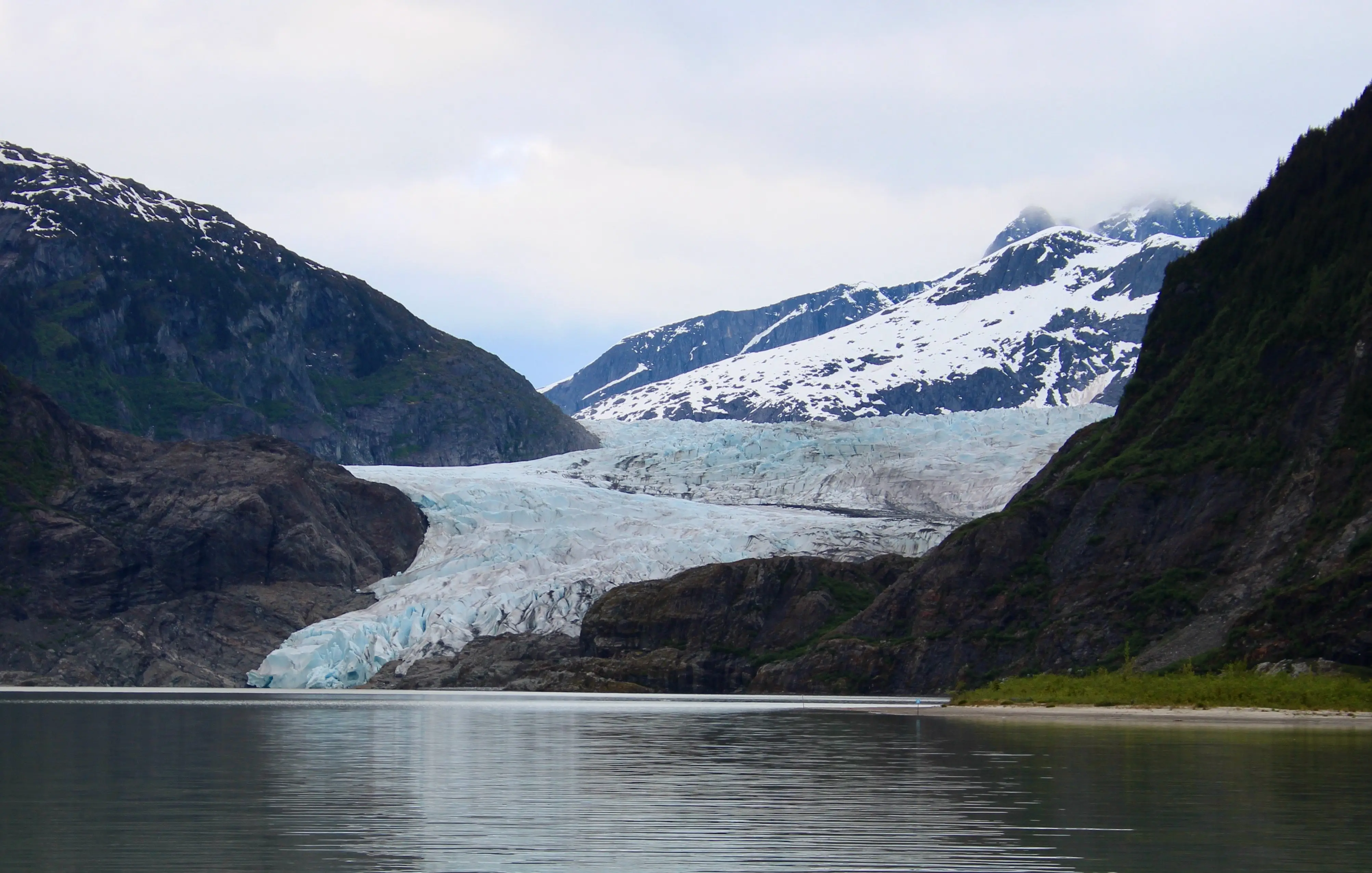 Mendenhall Glacier, here seen in summer 2025, has almost retreated entirely from the lake of its own making. Photo by David Polashenski.