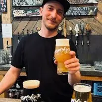 Valdez Brewing photo, guy holding a mug
