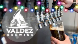 Valdez Brewing drink with holiday lights