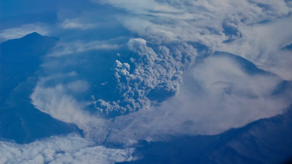 3. Mount Okmok erupts explosively on August 3, 2008. Photo by Burke Mees, Alaska Airlines.