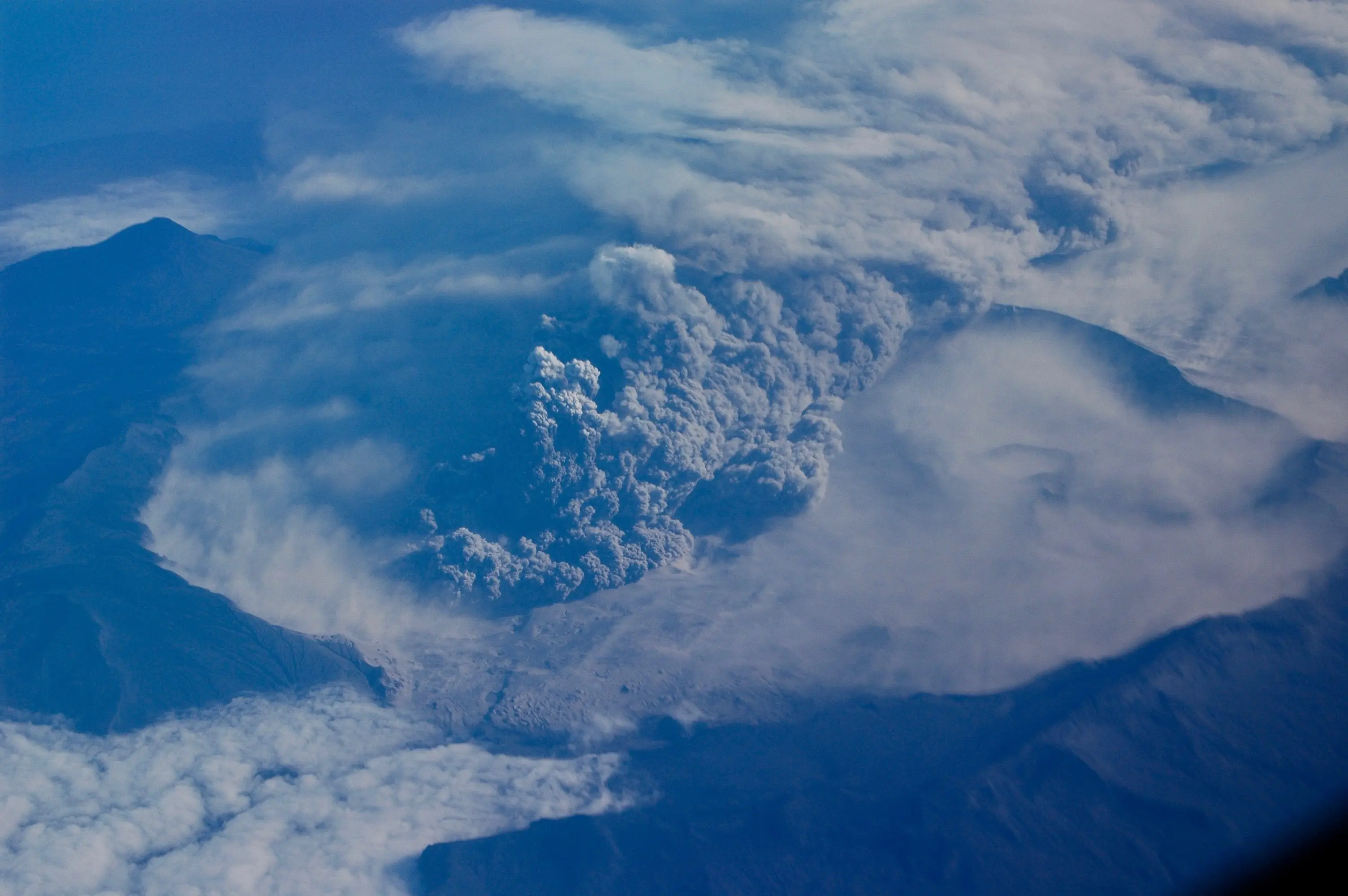 3. Mount Okmok erupts explosively on August 3, 2008. Photo by Burke Mees, Alaska Airlines.