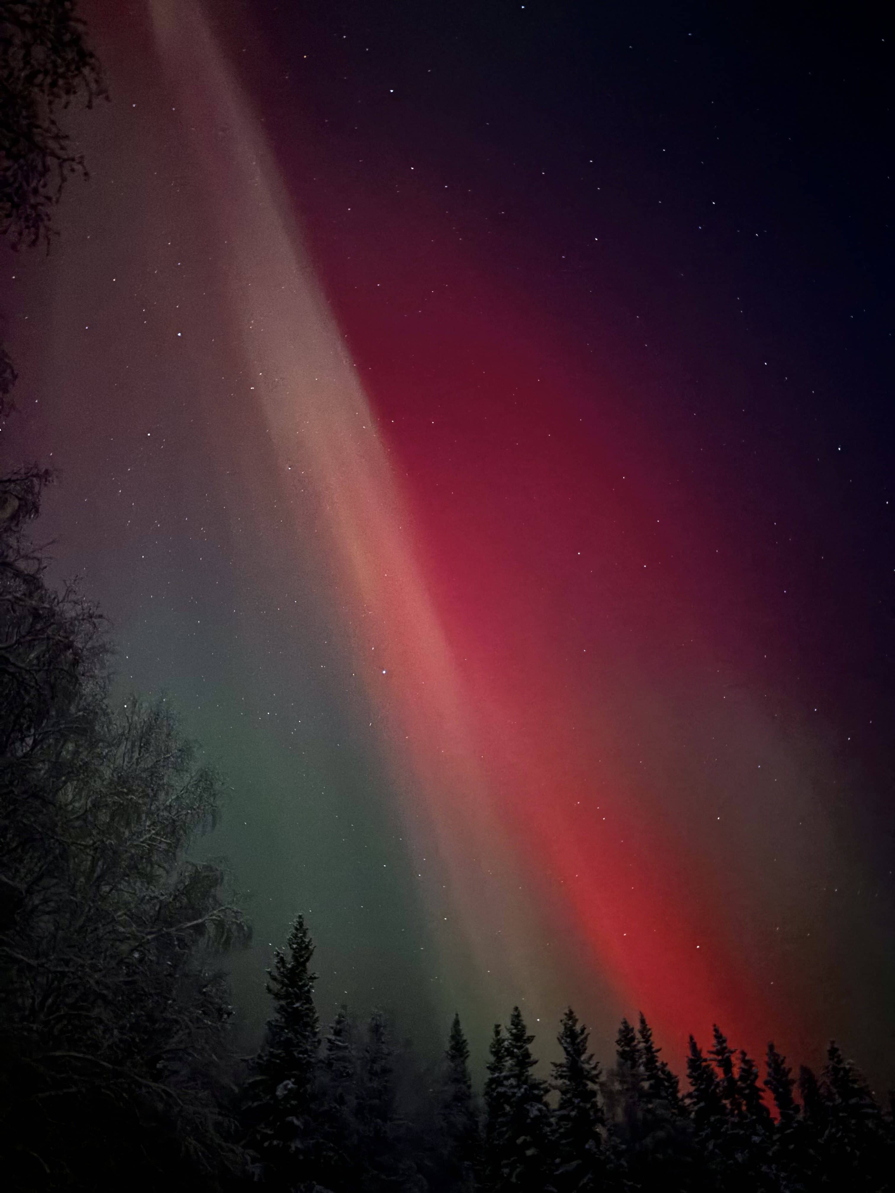 2. Red aurora fills the sky above Yankovich Road on the evening of Nov. 11, 2025. Photo by Nora Carlson.
