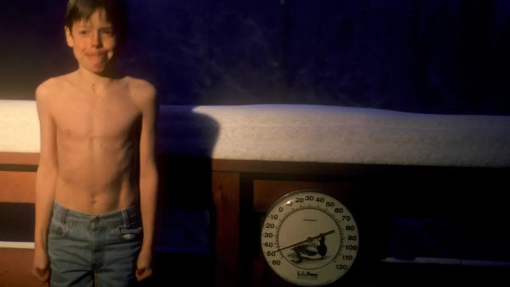 UAF seismologist Carl Tape, age 9, outside on his family’s Fairbanks deck at minus 50 degrees F on Jan. 23, 1989. Photo by his father, Walt Tape. “Carl was ahead of his time,” said Rick Thoman. “Now people pose in front of the UAF sign.”