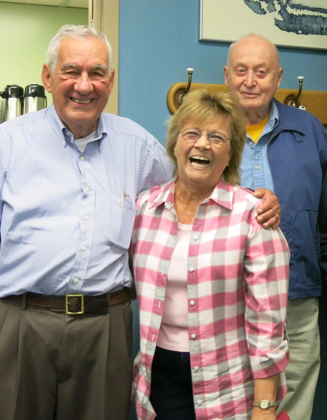 At the Elvey Building, home of UAF’s Geophysical Institute, Carl Benson, far right, and Val Scullion of the GI business office attend a 2014 retirement party with Glenn Shaw. Photo by Ned Rozell.