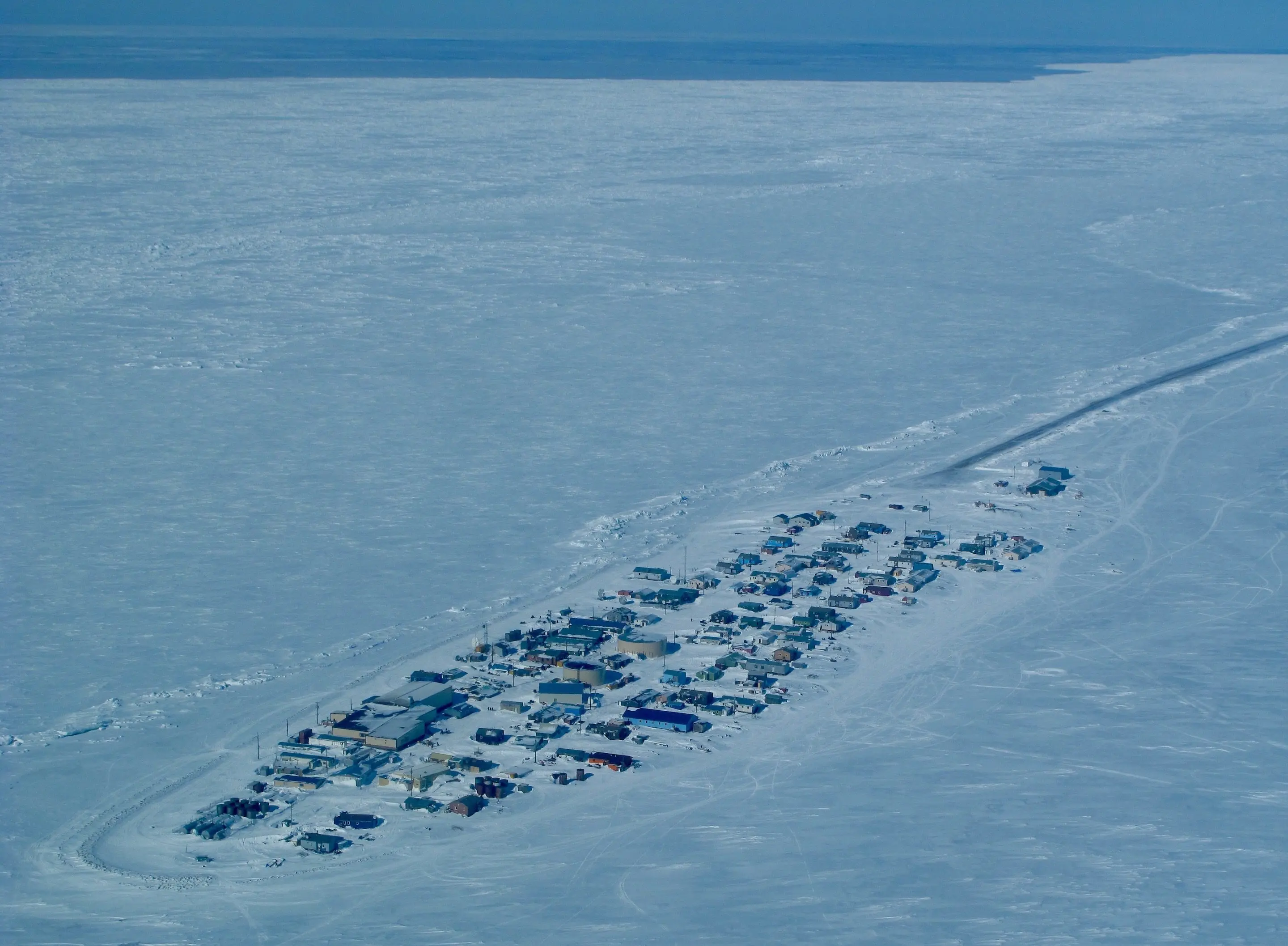 Northern sea ice, such as this surrounding the community of Kivalina, has declined dramatically in area and thickness over the last few decades. Photo by Ned Rozell.