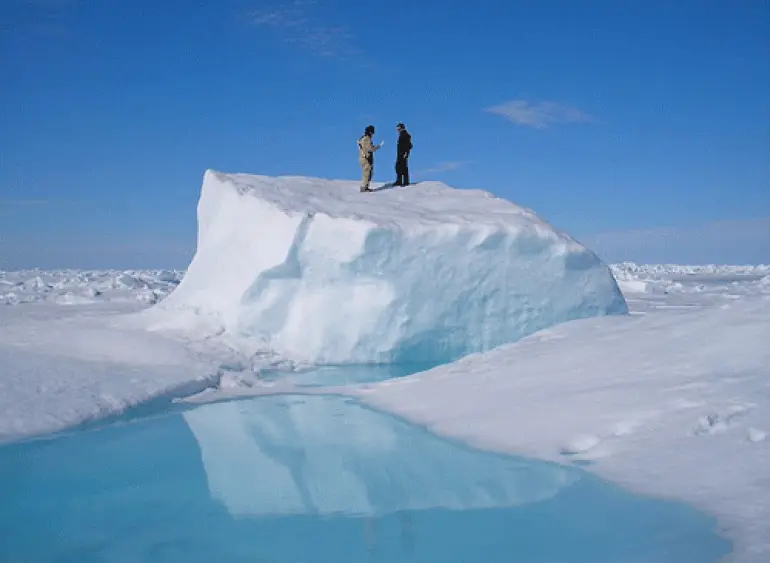 Matt Druckenmiller, right, and his research advisor Hajo Eicken, a professor of Geophysics, on an ice floe near Utqiaġvik in about 2010. Photo by Daniel Pringle.