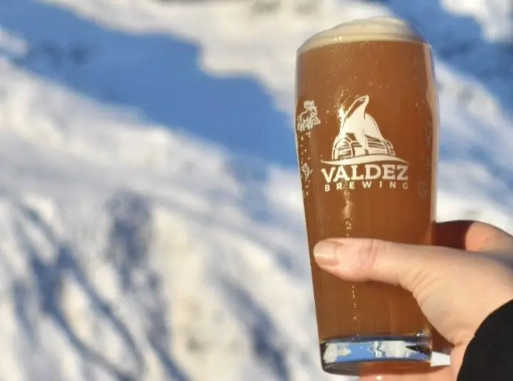 Can of Valdez Brewing Beer in Sunny Snowy Mountains
