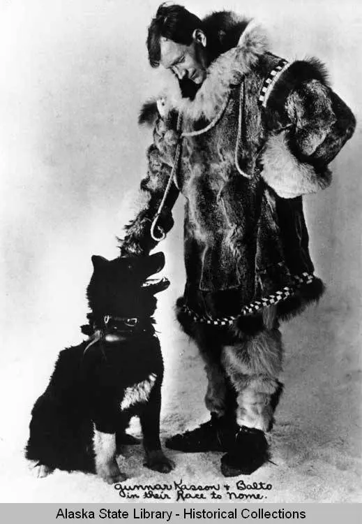 Serum Run musher Gunnar Kaasen poses with Balto, a leader on his mushing team. Alaska State Library Portrait File.