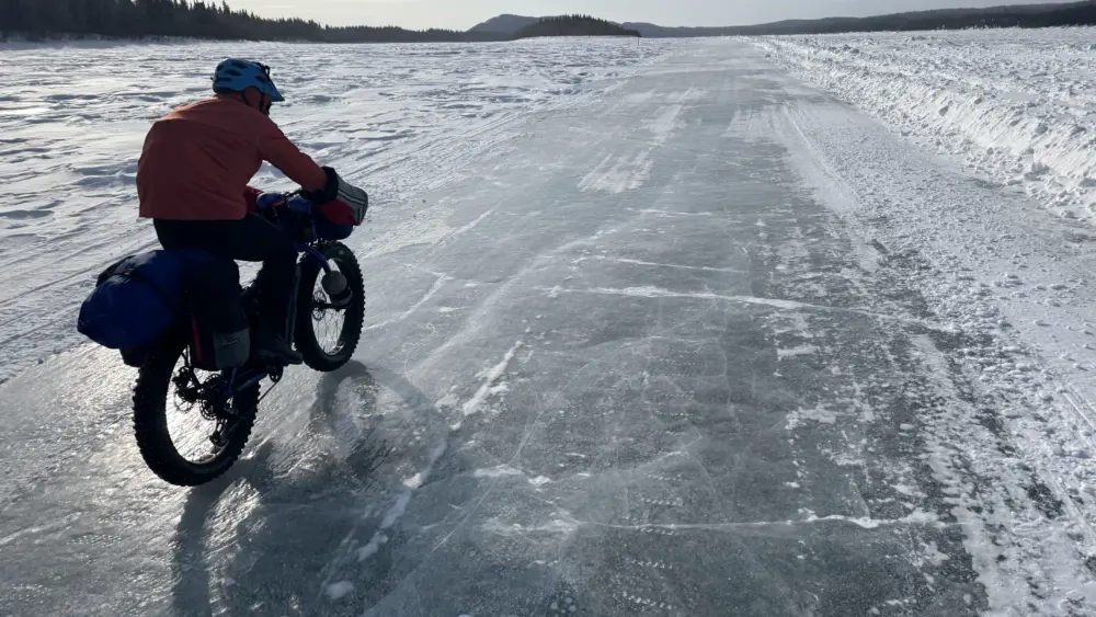 1. Ned Rozell rides a plowed winter road on the Yukon River that allows cars and trucks to drive between Manley Hot Springs and the village of Tanana in the winter. Photo by Forest Wagner.