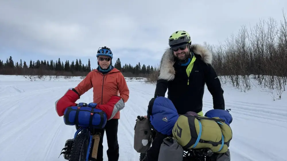 Ned Rozell, left, and Forest Wagner of Fairbanks push their bikes on the Unalakleet River just outside the village of the same name. Photo by Warren Katchatag.