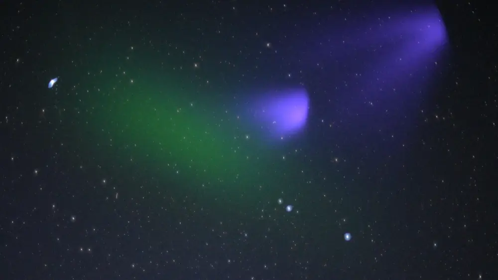 Ionization by the sun turns the green barium cloud of Peter Delamere’s KiNET-X experiment to purple over the Atlantic Ocean on May 16, 2021. Photo courtesy Don Hampton.