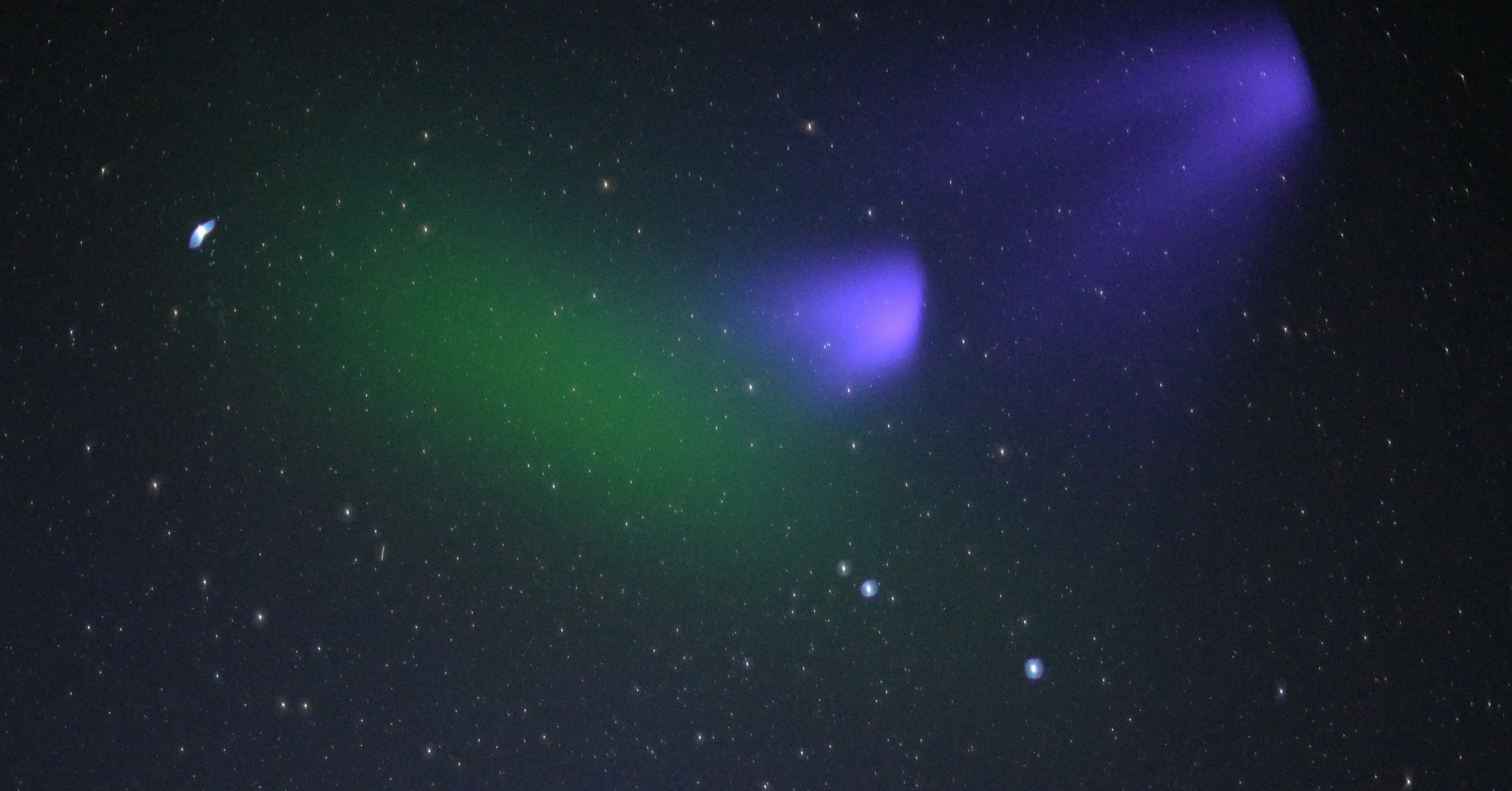 Ionization by the sun turns the green barium cloud of Peter Delamere’s KiNET-X experiment to purple over the Atlantic Ocean on May 16, 2021. Photo courtesy Don Hampton.