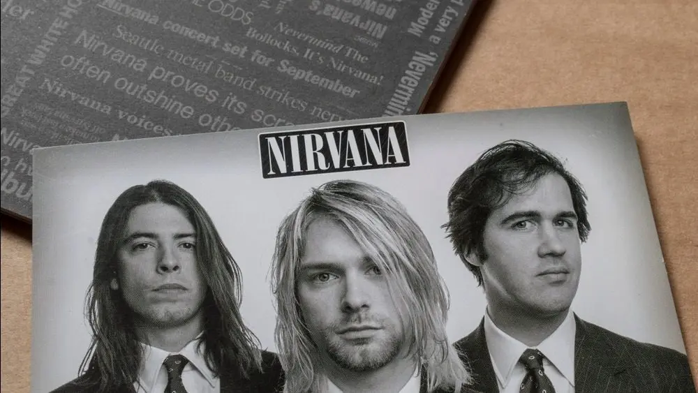 'Nirvana' music album booklet with band portrait^ isolated on light plain background^ top angle shot. 26 May 2025 - Limerick^ Ireland