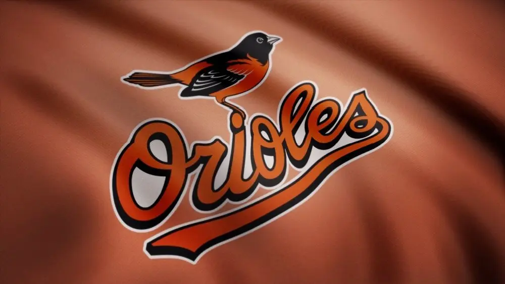 WAVING flag with Baltimore Orioles professional team logo. Close-up of waving flag with Baltimore Orioles MLB baseball team logo^ seamless loop.