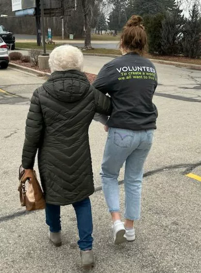 volunteer-walking-with-elderly-person-2-cropped