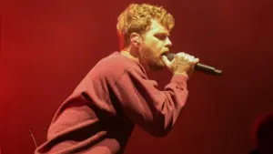 Alex Warren performs in Hollywood^ Florida^ on October 8^ 2025. The performance was part of his Cheaper Than Therapy world tour.