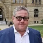 karlin-headshot-e1658143363567-150x150566560-1