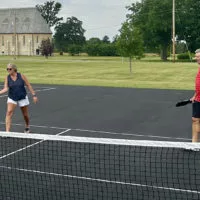 Lisa Lucchini and Brad Lucchini^ avid Pickleball players visiting from Florida^ play at the new courts in Knoxville.