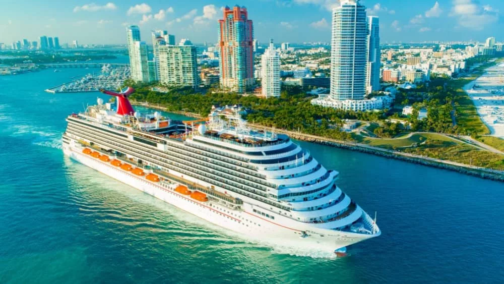 Carnival Magic cruise ship^ entrance to Atlantic Ocean^ from Miami port. USA. FLORIDA. MIAMI BEACH. DECEMBER^ 2018