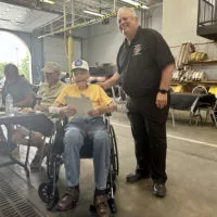 State Representative Dan Swanson presents a proclamation to former Galesburg Firefighter Bob Redfern for his service and upcoming 100th birthday at a celebration Tuesday at Galesburg Central Fire Station.