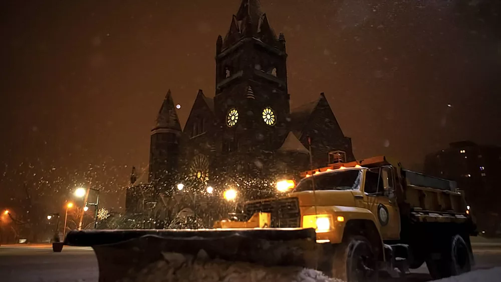 A City of Galesburg plow truck passes Central Congregational Church as it pushes snow off the Public Square during a winter storm on Jan. 5^ 2015. (STEVE DAVIS/Seedcophoto.com)