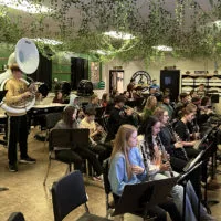 The ROWVA High School band goes through a final rehearsal Monday in Oneida^ prior to its Tuesday^ Dec. 31^ 2024^ appearance in Champaign.