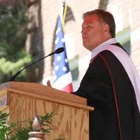 Lon Helton^ a 1972 Monmouth graduate at the host of Country Countdown USA^ gave the main Commencement address