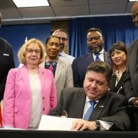 Gov. JB Pritzker signs Illinois’ fiscal year 2026 budget on June 16^ outlining $55.1 billion in state spending. (Capitol News Illinois photo by Andrew Adams)