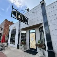 The door at Innkeeper's Fresh Roasted Coffee^ 80 N. Seminary St.^ remains boarded after a break-in early Sunday^ July 27^ 2025.