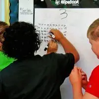 Students do math problems at an elementary school in Springfield. (Capitol News Illinois photo by Andrew Campbell)