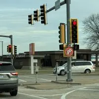 Traffic signal displaying "No Right Turn on Red" at Carl Sandburg Drive and North Henderson Street intersection