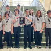 Galesburg High School students holding Scholastic Bowl championship award