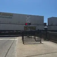 A stopped BNSF freight train blocking the North Prairie Street railroad crossing in Galesburg^ Illinois