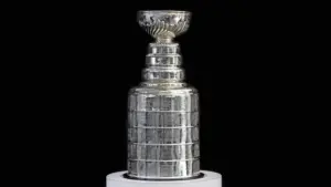 NHL ceremony - Stanley Cup trophy on the white stand^ black background^ Vancouver BC - October 22^ 2018