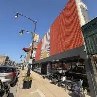 The colorful and orange facade of the Orange Cup Sidecar building in downtown Galesburg