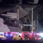 FILE - An Amazon distribution center is heavily damaged after a strong thunderstorm moved through the area^ Dec. 10^ 2021^ in Edwardsville^ Ill. On Tuesday^ April 26^ 2022^ the federal Occupational Safety and Health Administration said its investigation into the deadly collapse of the warehouse has “raised concerns about the potential risk to employees” during weather emergencies. (AP Photo/Jeff Roberson^ File)
