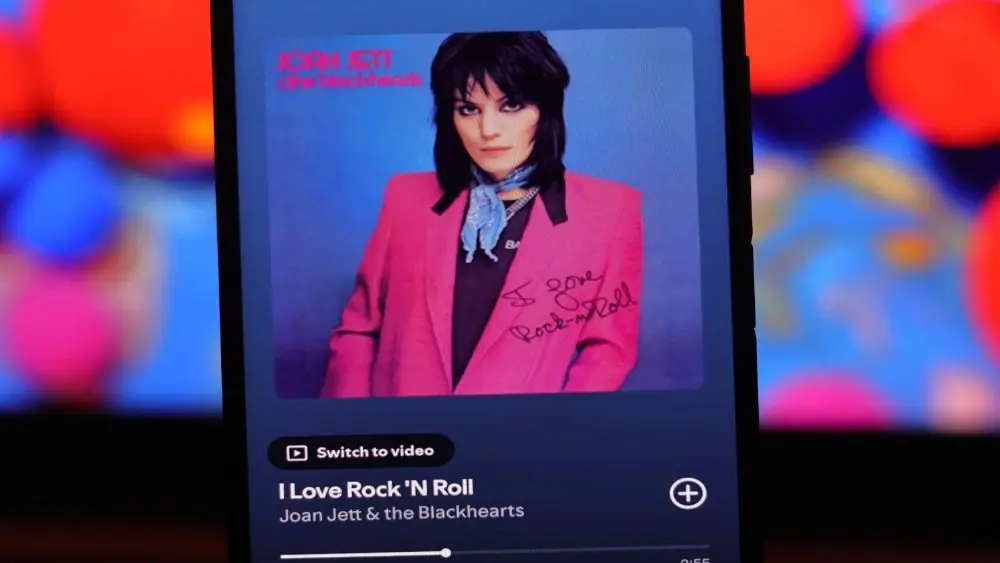 The image displays the Spotify interface playing the song "I Love Rock 'N Roll " by Joan Jett and the Blackhearts. Quezon City^ Philippines - August 20^ 2025