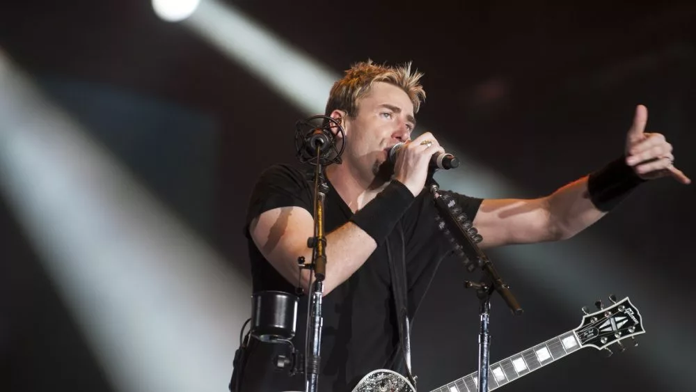 Chad Kroeger^ lead vocalist of the Canadian band Nickelback^ performs during the Rock in Rio 2013 concert^ on September 20^ 2013 in Rio de Janeiro^ Brazil.